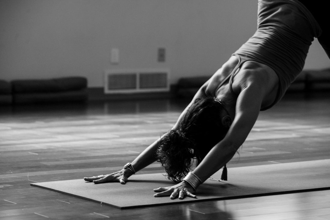 Woman in downward dog on an eco-friendly yoga mat