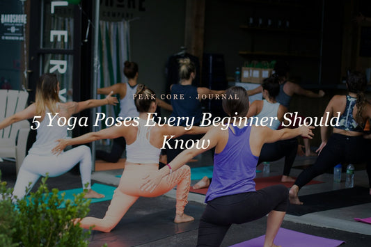 Yoga class practicing warrior pose — 5 yoga poses every beginner should know