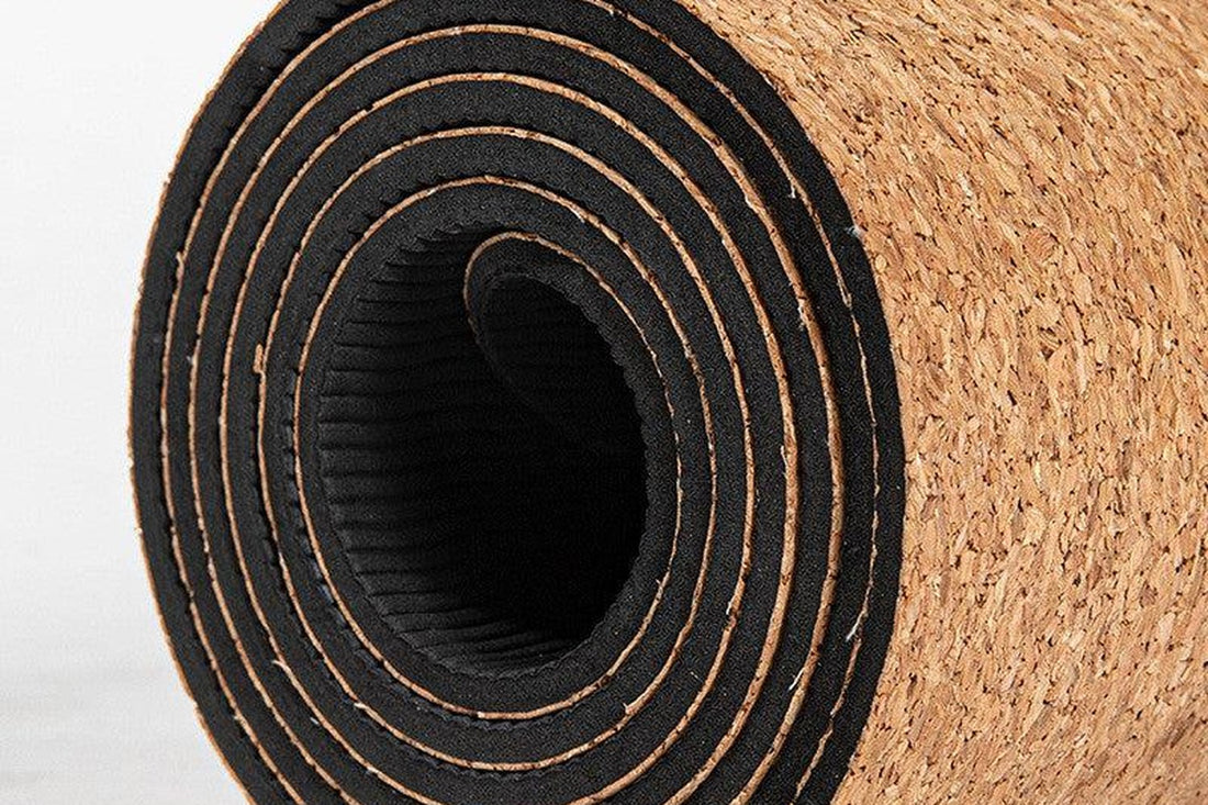 Rolled cork yoga mat close-up — non-slip grip for sweaty hands