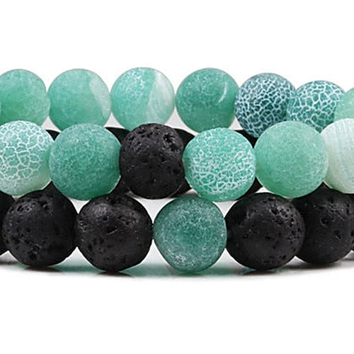 Close-up of crackle agate and lava stone beads on Calm yoga bracelet